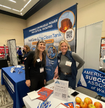 conference attendees at booth